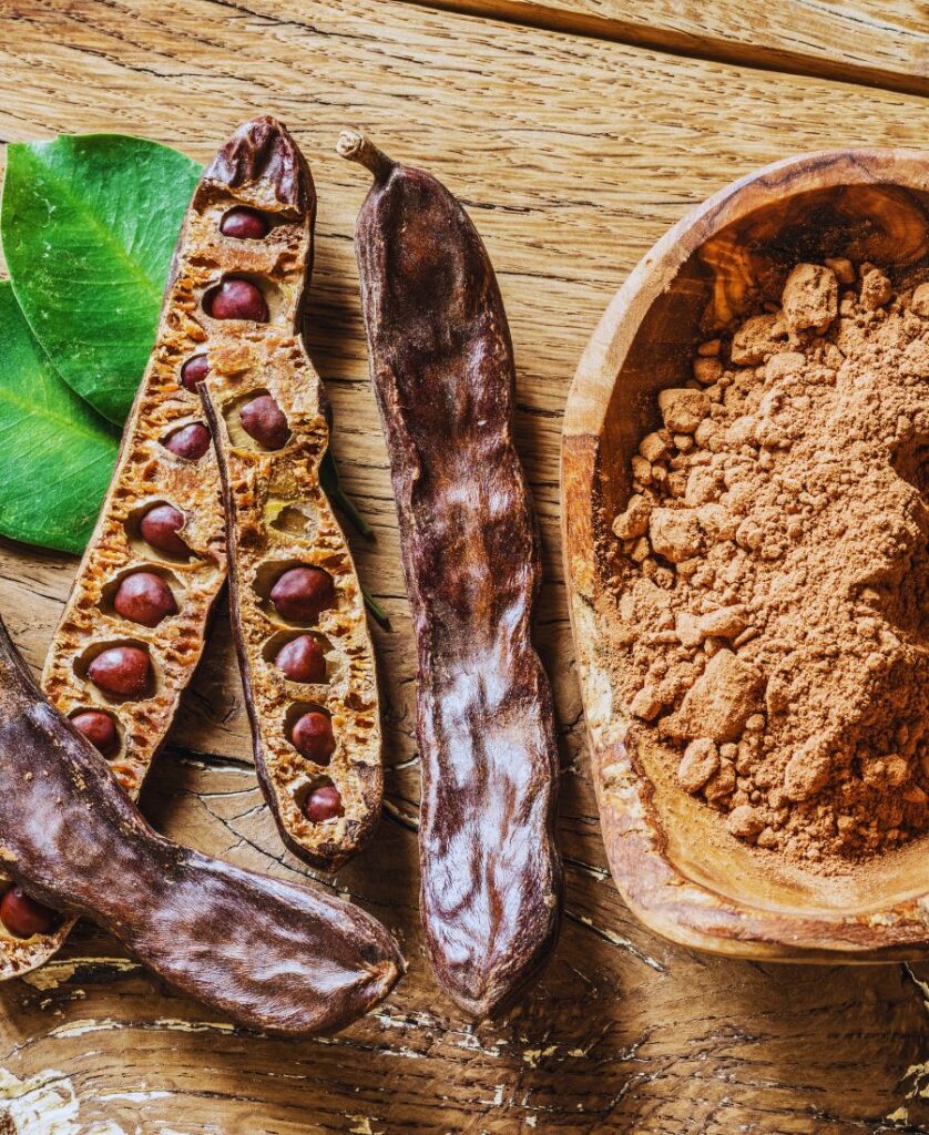 Close-up of carob powder showing natural texture and color